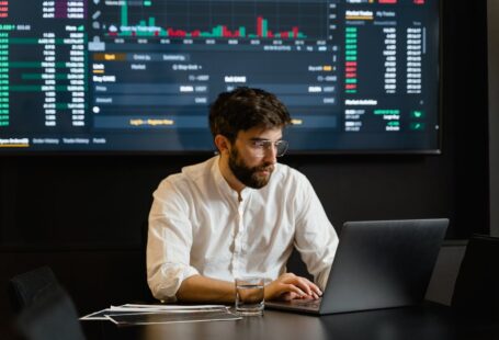 man-in-white-dress-shirt-using-laptop